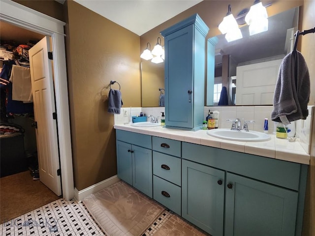 bathroom with vanity and decorative backsplash