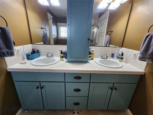 bathroom featuring vanity and decorative backsplash