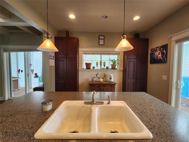 kitchen featuring sink and hanging light fixtures