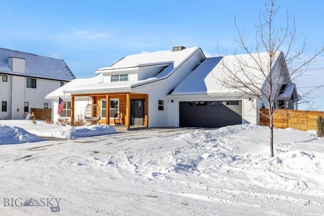 view of front of house featuring a garage and covered porch