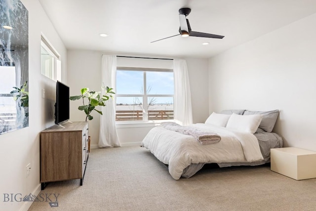 bedroom with light colored carpet, recessed lighting, baseboards, and a ceiling fan