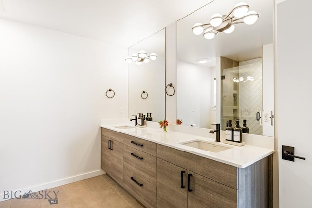 bathroom with walk in shower, vanity, and tile patterned flooring