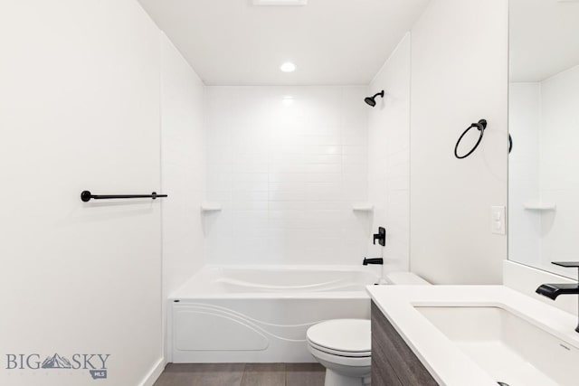 full bathroom with shower / washtub combination, hardwood / wood-style floors, vanity, and toilet