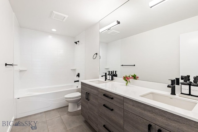 full bathroom featuring vanity, tiled shower / bath, tile patterned floors, and toilet