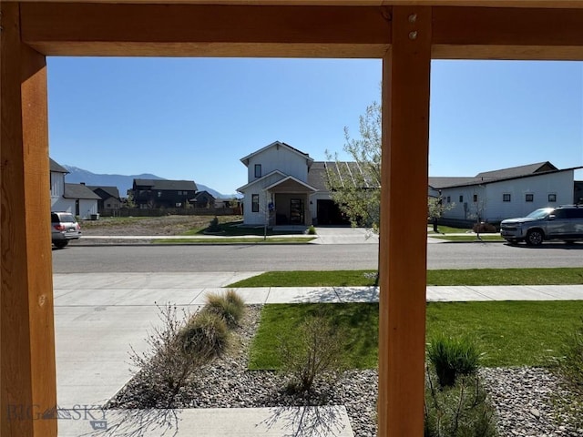 exterior space featuring a mountain view and a residential view