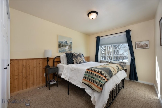 20 Talon Way Unit D, Bozeman, MT 59718 - carpeted bedroom featuring a wainscoted wall and wood walls