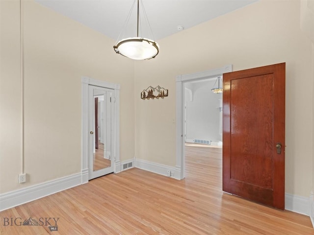 empty room with light wood-type flooring