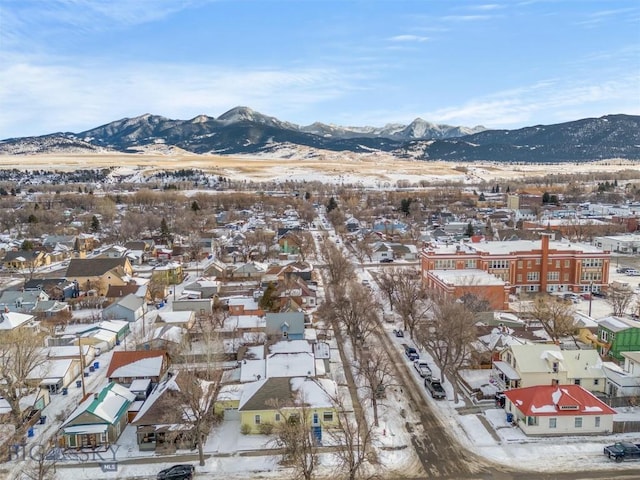 snowy aerial view featuring a mountain view