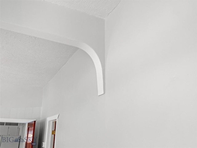 interior details featuring a textured ceiling