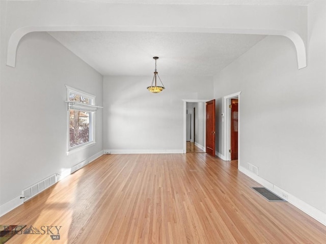 spare room with light hardwood / wood-style floors