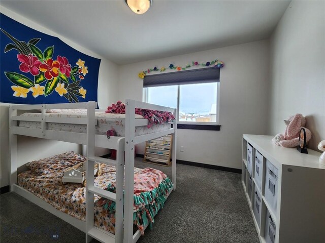 carpeted bedroom with baseboards