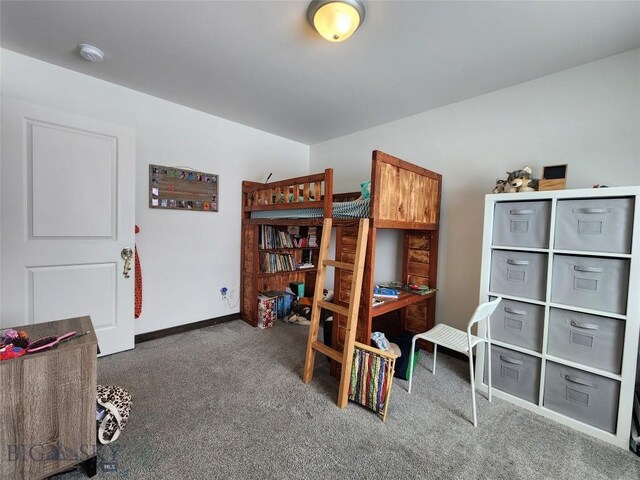 carpeted bedroom with baseboards