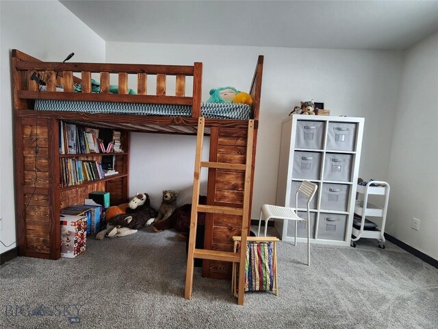 bedroom featuring baseboards and carpet floors