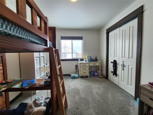 bedroom with a closet and carpet floors