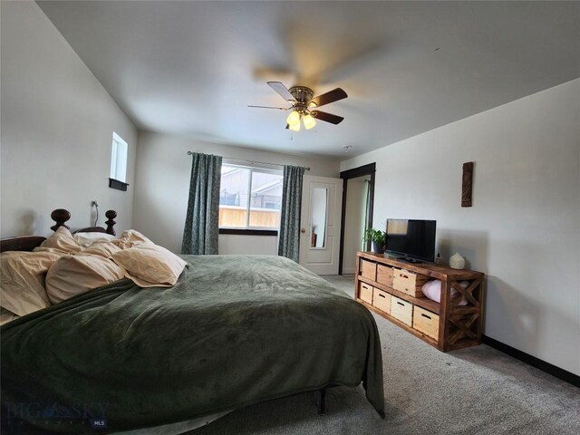 carpeted bedroom featuring a ceiling fan and baseboards