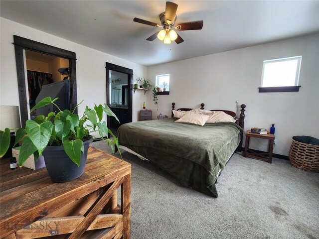 bedroom with carpet flooring, multiple windows, and ceiling fan