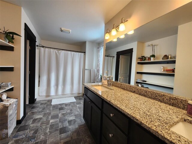 full bathroom featuring vanity and stone finish flooring