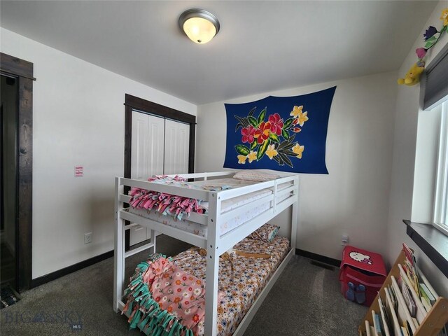 bedroom with baseboards and carpet floors