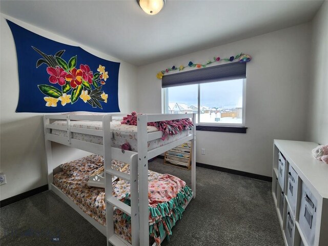 carpeted bedroom with baseboards