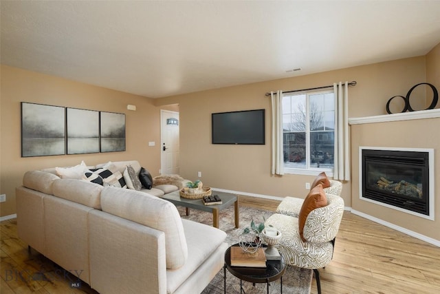 living room with light hardwood / wood-style floors