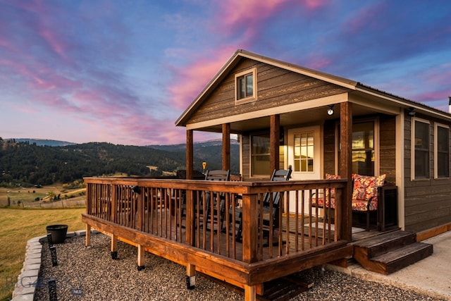 exterior space with a deck with mountain view