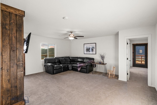 living room featuring light carpet and ceiling fan