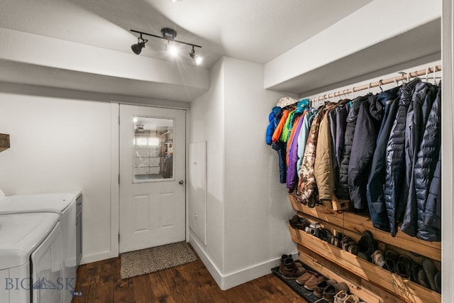 laundry area with track lighting, dark hardwood / wood-style flooring, and washer and clothes dryer