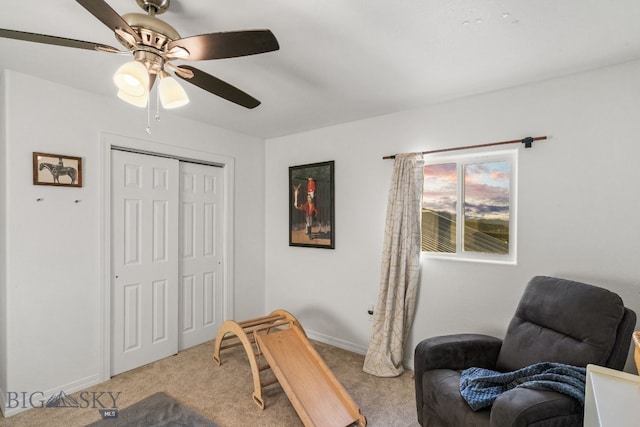 sitting room featuring light colored carpet