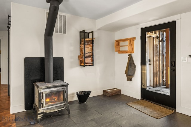 interior space with a wood stove