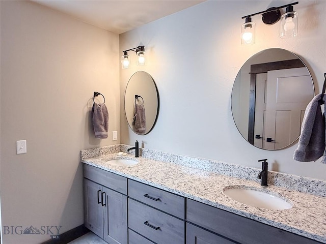 bathroom with double vanity and a sink