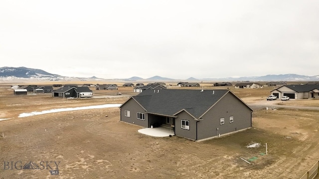 exterior space with a mountain view and a residential view