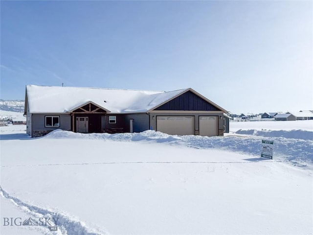 single story home featuring board and batten siding