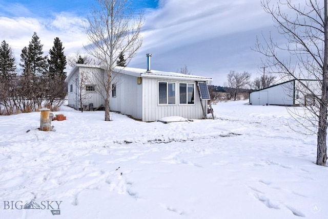 view of snow covered property