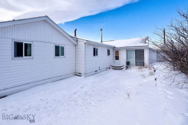 view of snow covered house