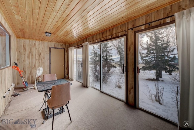 sunroom featuring wooden ceiling