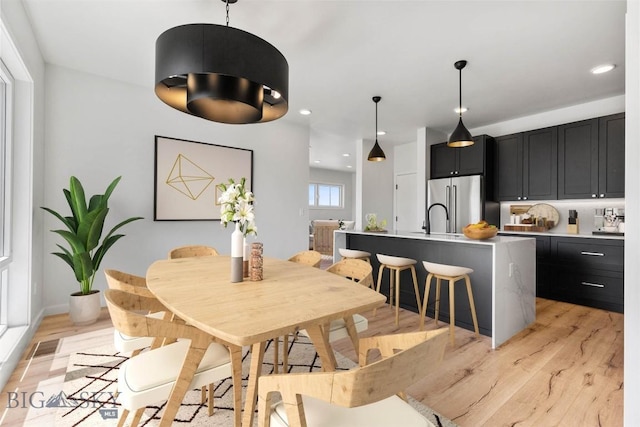 dining area with light hardwood / wood-style flooring