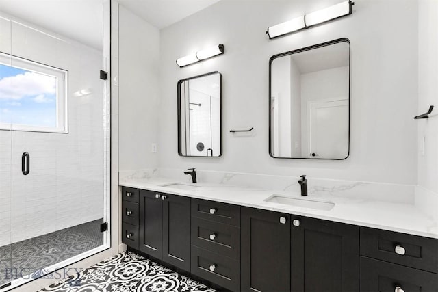 bathroom featuring vanity, an enclosed shower, and tile patterned flooring