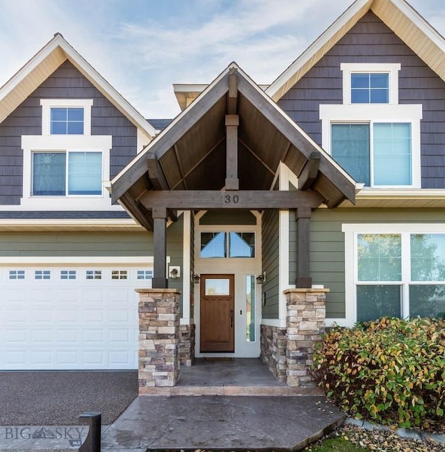 doorway to property featuring a garage