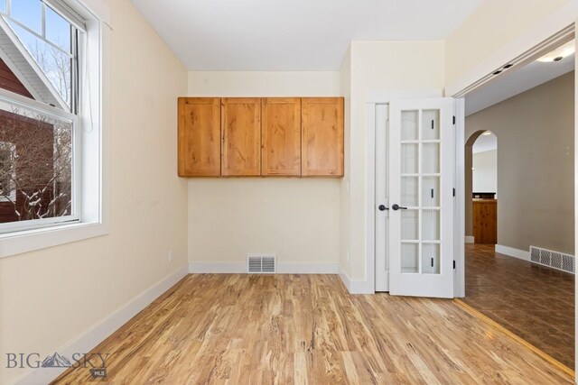 spare room featuring light hardwood / wood-style floors