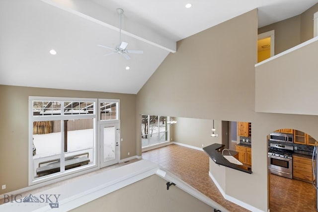 living room featuring beam ceiling, high vaulted ceiling, and ceiling fan