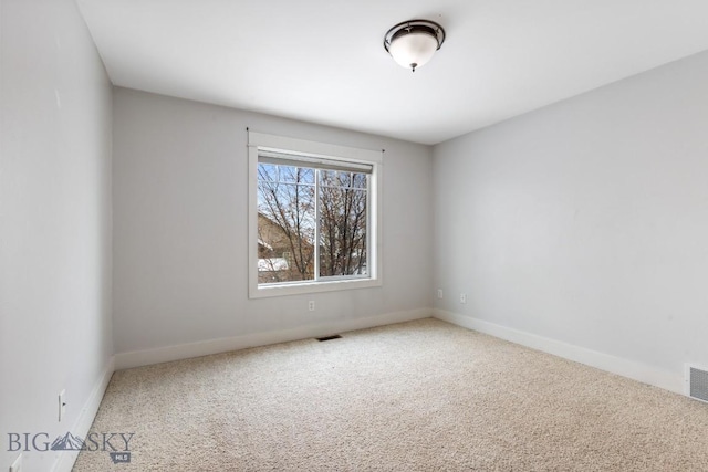 unfurnished room featuring carpet floors