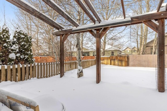 view of yard layered in snow