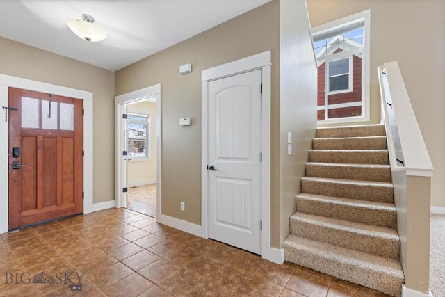 foyer entrance featuring tile patterned floors