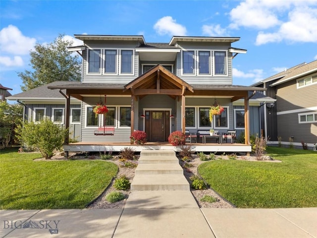 view of front of property featuring a porch and a front yard