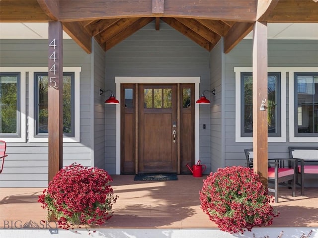 entrance to property featuring covered porch