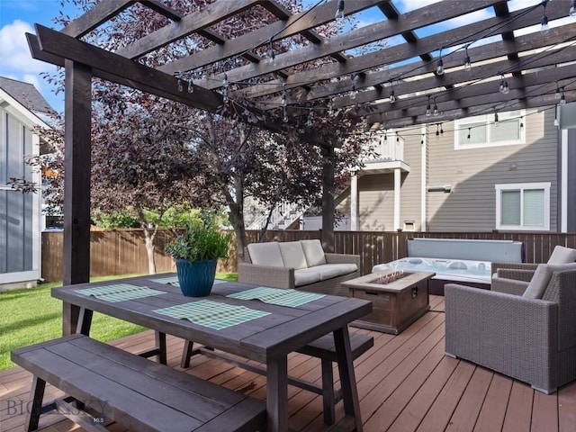 wooden terrace with a pergola and an outdoor living space with a fire pit