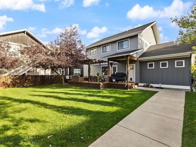 back of property with a lawn and a pergola