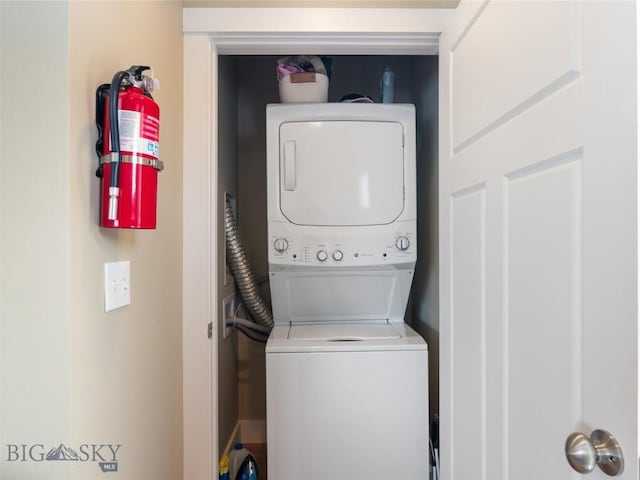 laundry room featuring stacked washing maching and dryer