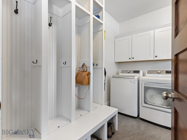 laundry area featuring cabinets and washing machine and dryer