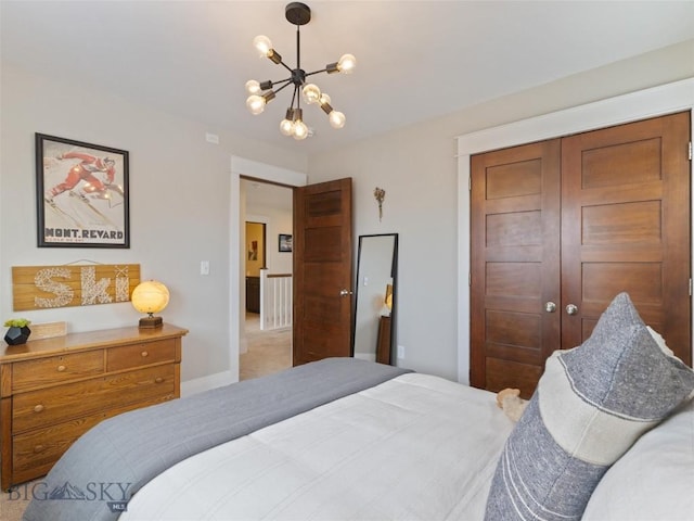 bedroom with a notable chandelier